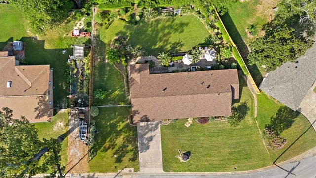 an aerial view of a residential houses with outdoor space