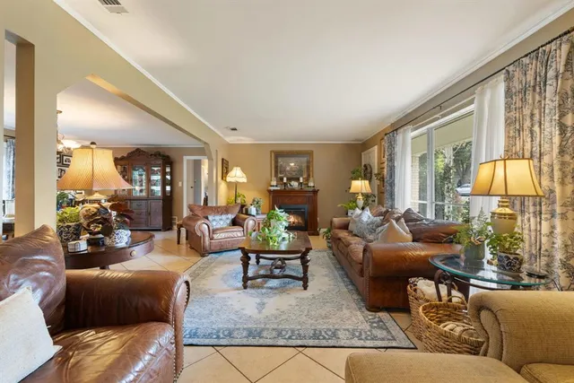 a living room with furniture and a lamp