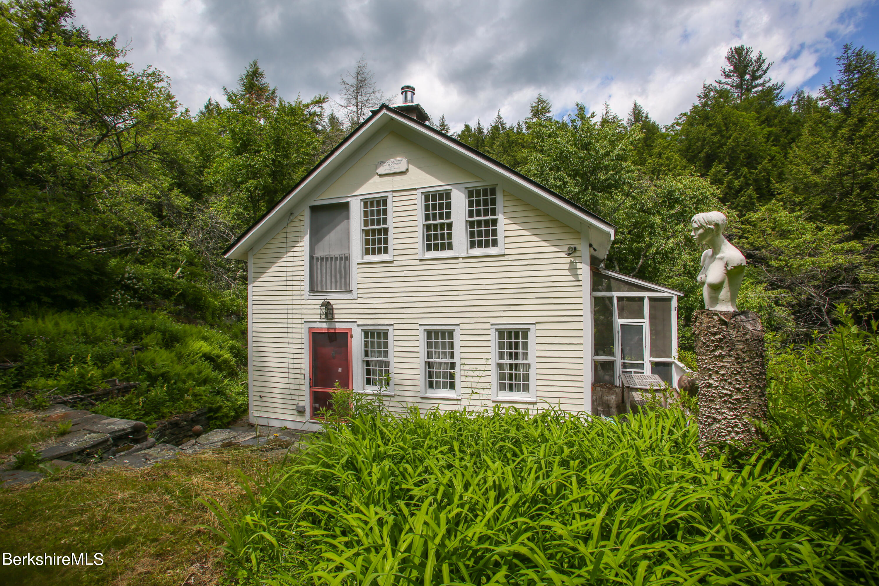 818 Main Road Chesterfield, MA 01084 - Photo 1 of 33 a view of a house with yard and plants