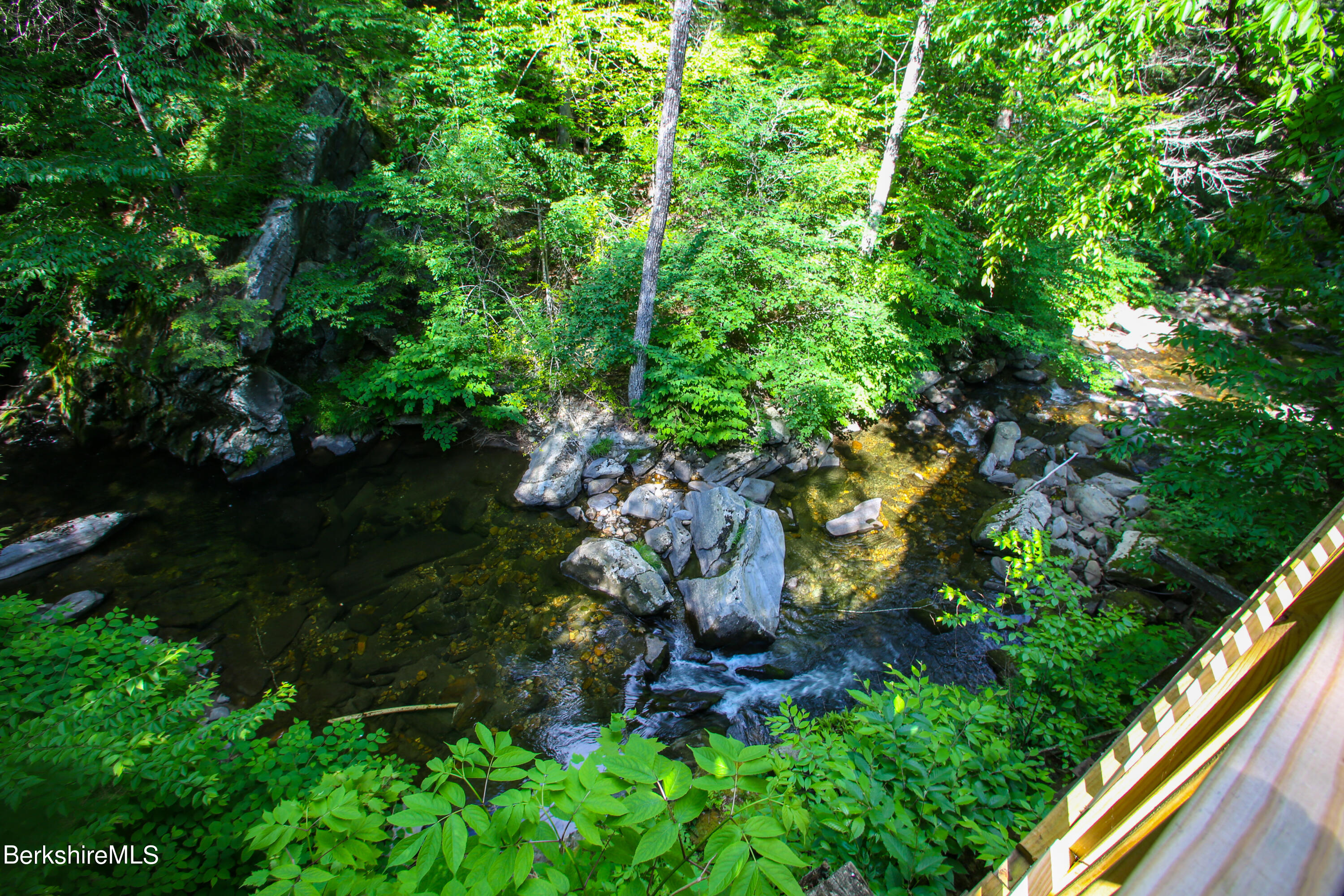 818 Main Road Chesterfield, MA 01084 - Photo 20 of 33 a backyard of a house with lots of green space