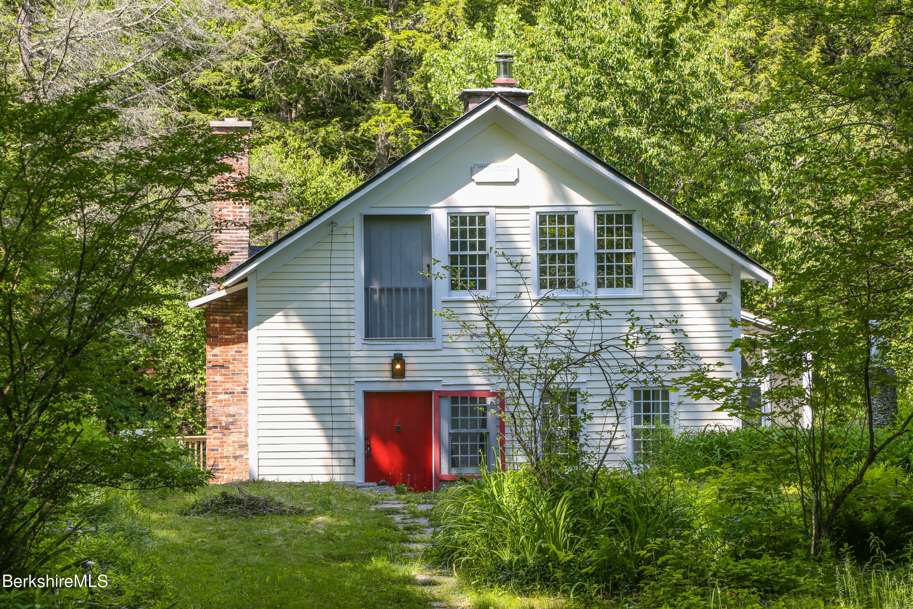 818 Main Road Chesterfield, MA 01084 - Photo 2 of 33 a front view of house with yard and trees in the background