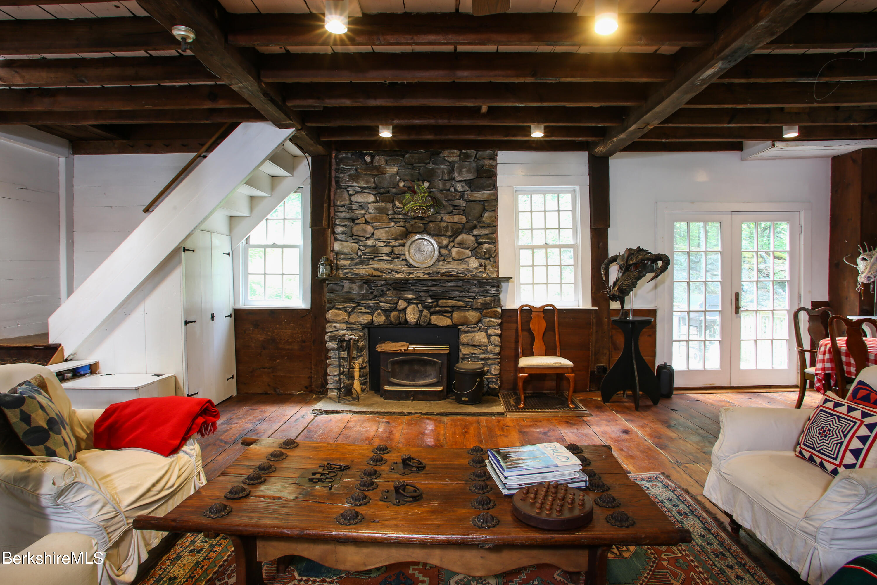 818 Main Road Chesterfield, MA 01084 - Photo 7 of 33 a living room with furniture and a fireplace