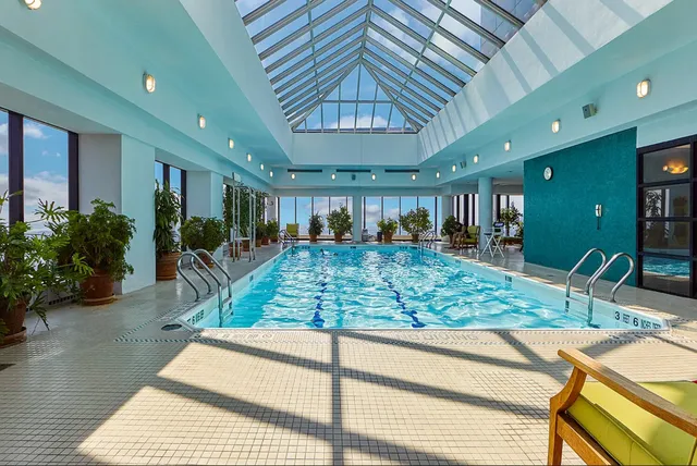 a lobby with furniture and rug