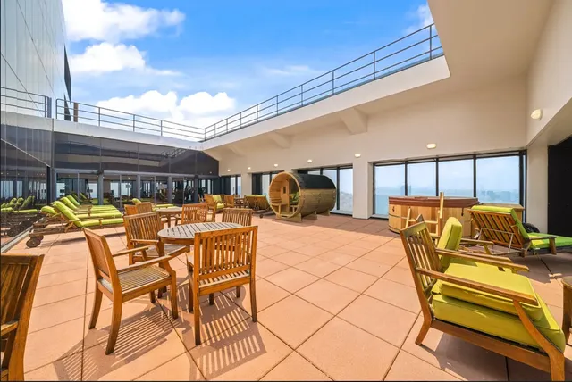 a view of swimming pool with seating area