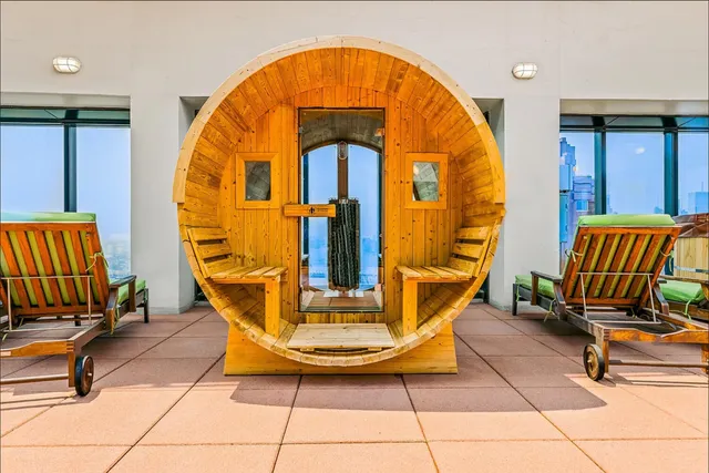 a view of a patio with table and chairs with wooden floor