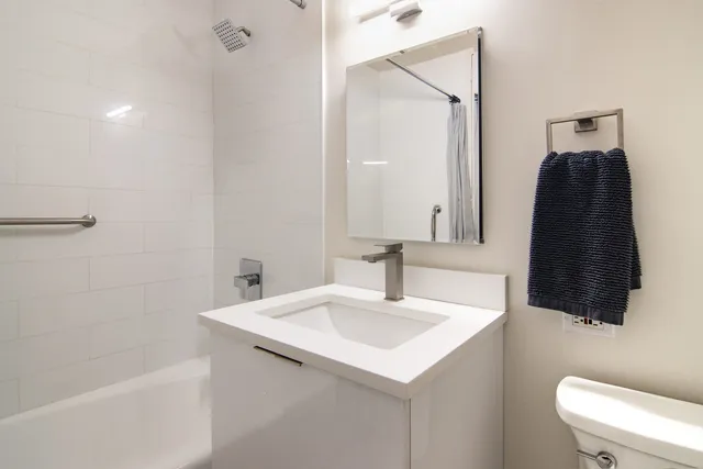 a kitchen that has a sink and a stove top oven