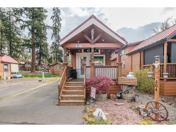 a front view of a house with a garden and patio