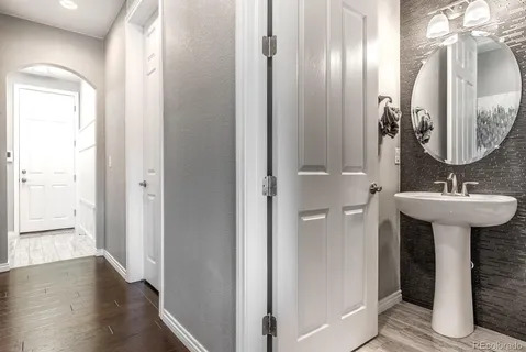 a bathroom with a mirror and a sink