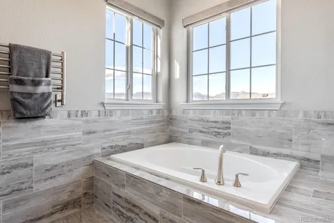 a bath tub sitting next to a window