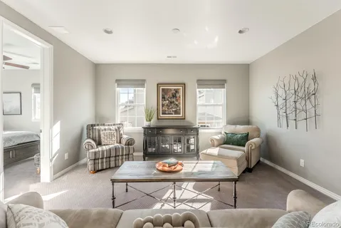 a living room with furniture and a table