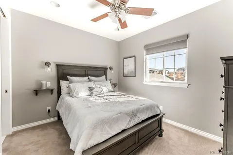 a bedroom with a bed and window