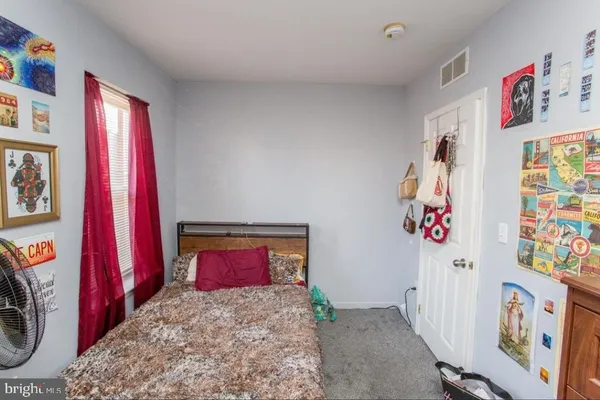 a bed room with a bed and a couch