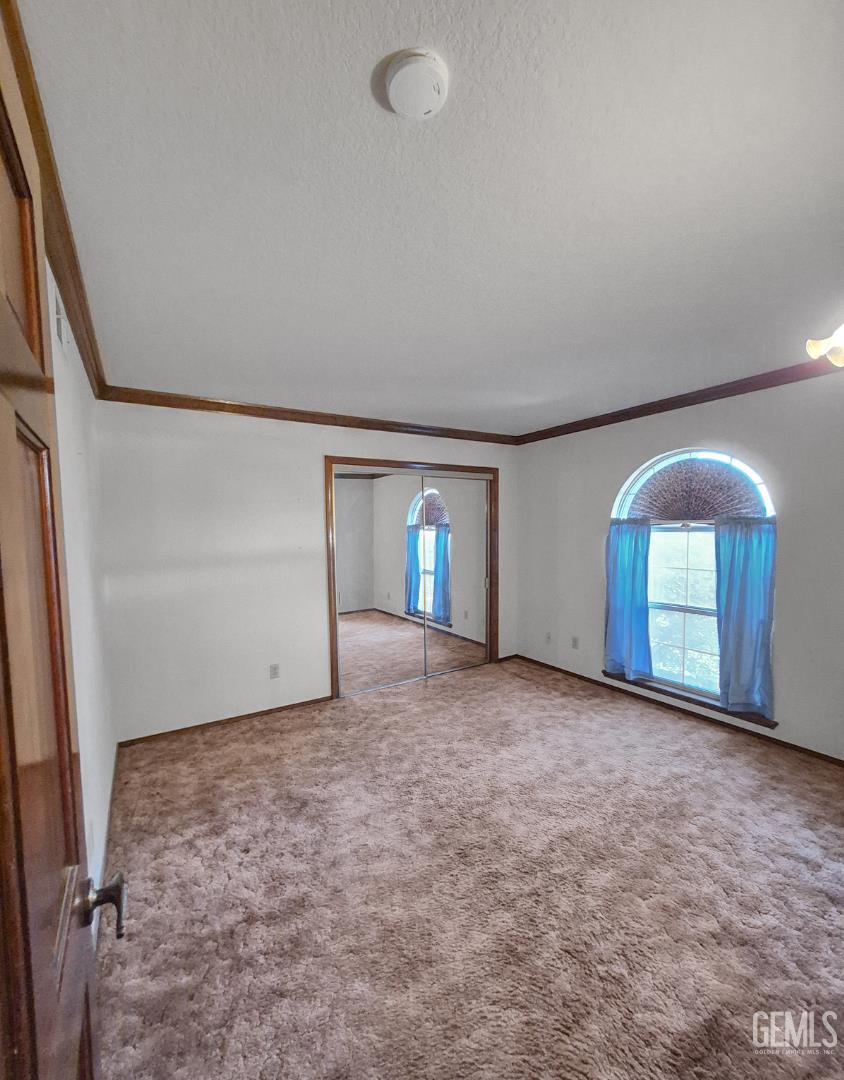 Undisclosed Address Lancaster, CA 93536 - Photo 15 of 22 an empty room with windows and closet