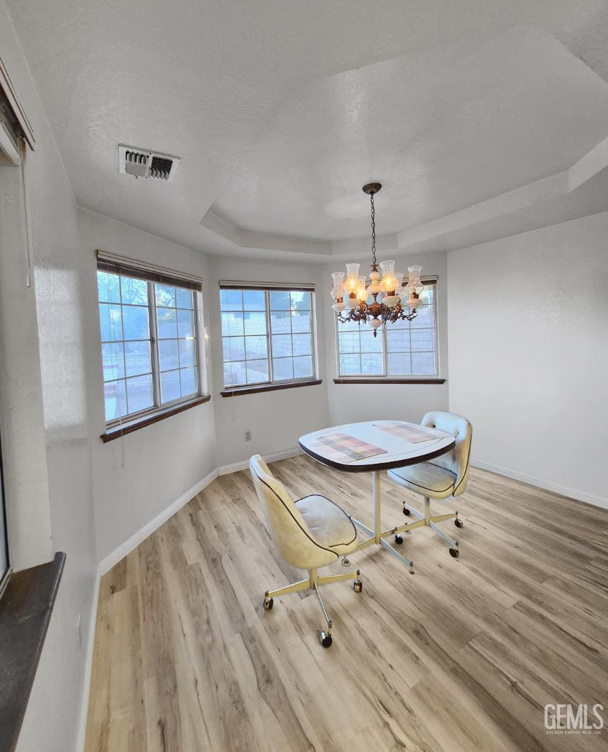 Undisclosed Address Lancaster, CA 93536 - Photo 10 of 22 a view of a livingroom with furniture window and wooden floor