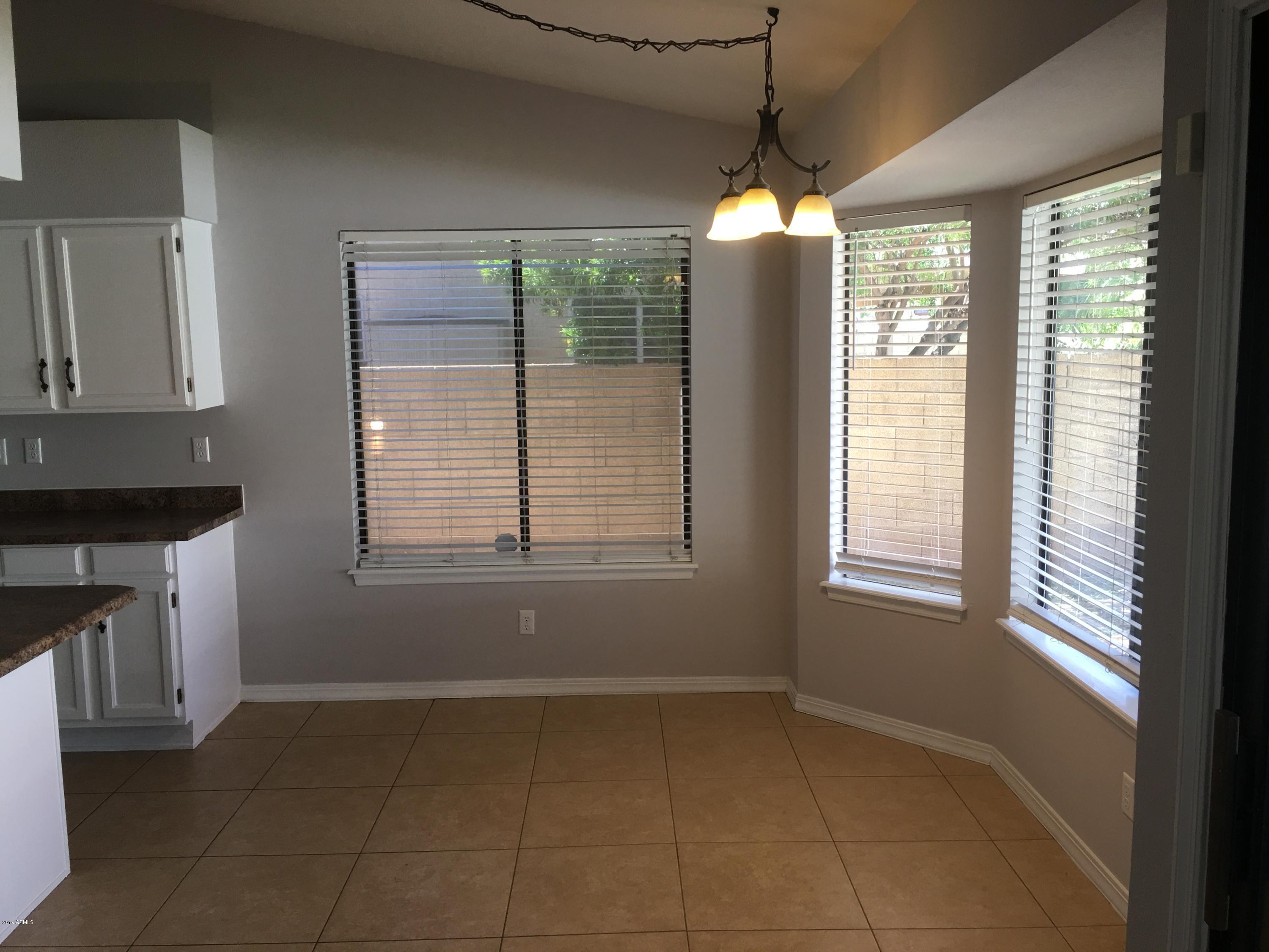 432 East Harwell Road Gilbert, AZ 85234 - Photo 6 of 17 a view of an empty room with a window