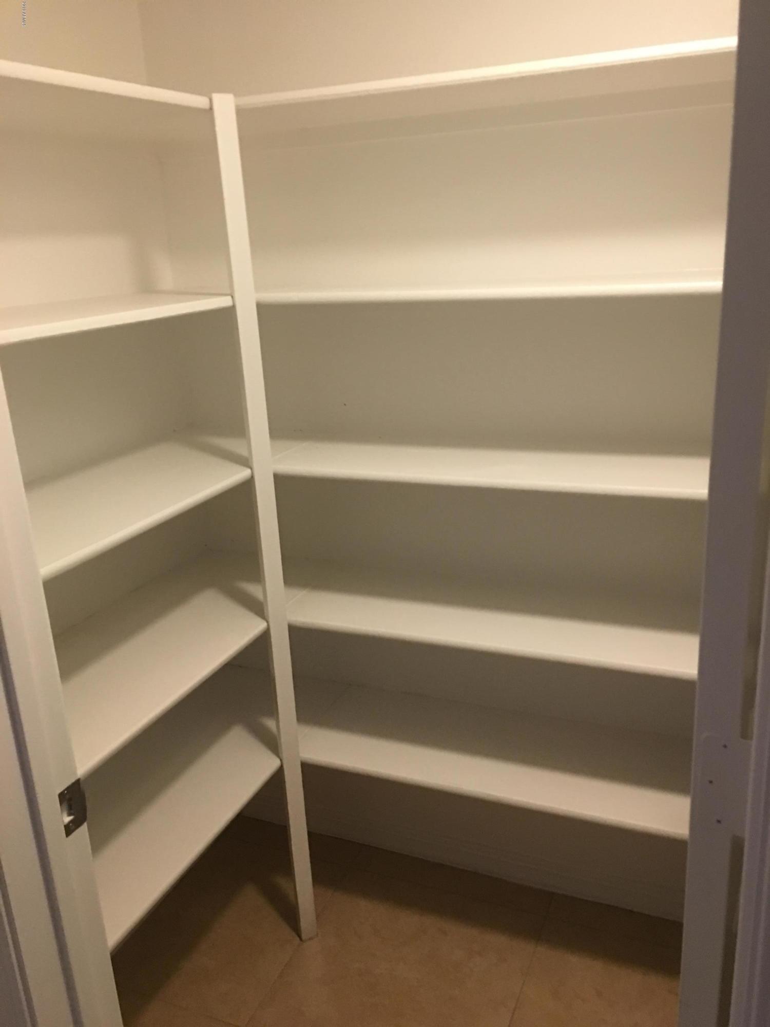 432 East Harwell Road Gilbert, AZ 85234 - Photo 7 of 17 a view of walk in closet with empty racks