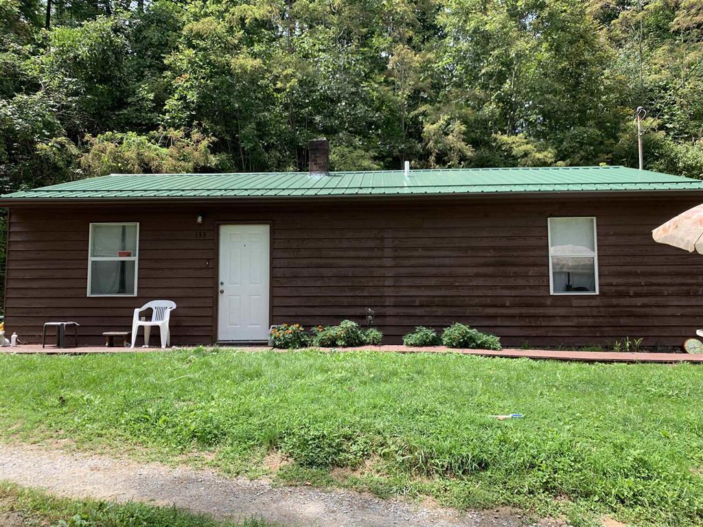 384 Camp Creek Road Northwest Riner, VA 24149 - Photo 5 of 12 a front view of a house with a yard