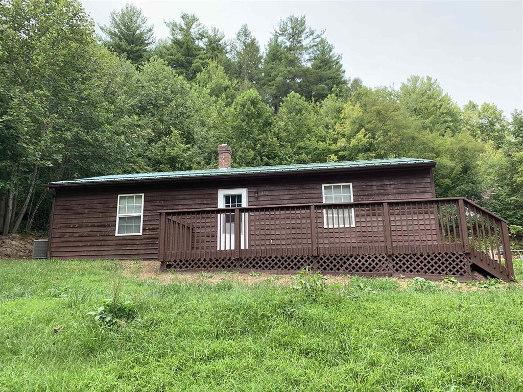 384 Camp Creek Road Northwest Riner, VA 24149 - Photo 6 of 12 a side view of a house with a yard