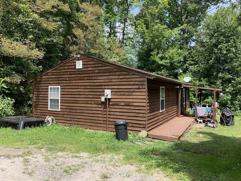 384 Camp Creek Road Northwest Riner, VA 24149 - Photo 7 of 12 a front view of a house with a yard