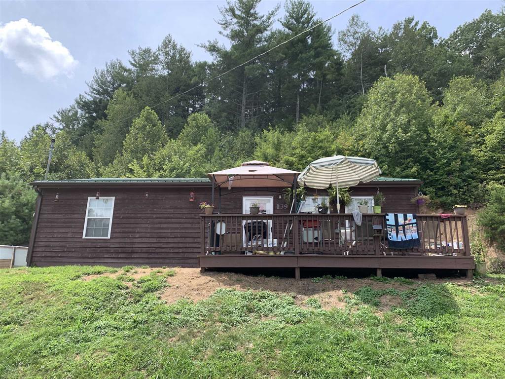 384 Camp Creek Road Northwest Riner, VA 24149 - Photo 10 of 12 a view of a house with a yard