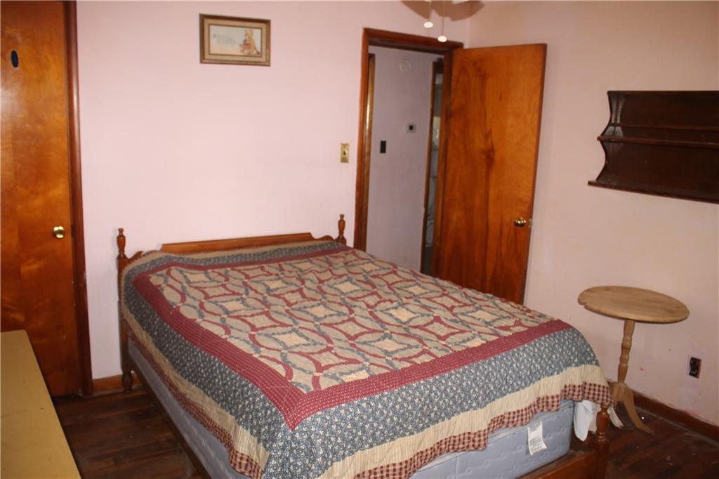 716 Kaye Avenue Monaca, PA 15061 - Photo 8 of 9 a bedroom with a bed and cabinets