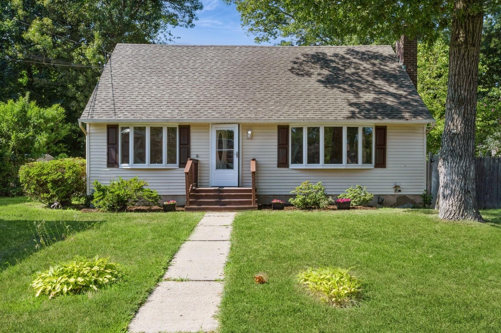 237 Clay Pitts Road East Northport, NY 11731 - Photo 1 of 1 a front view of a house with a yard