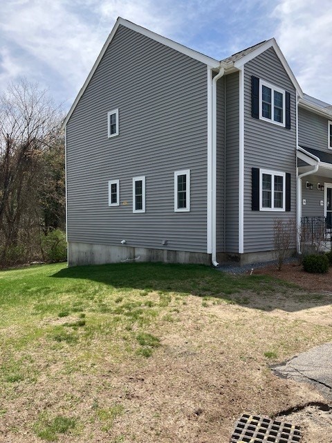 34 Lowell Road, Unit 36 Pepperell, MA 01463 - Photo 12 of 12 a backyard of a house
