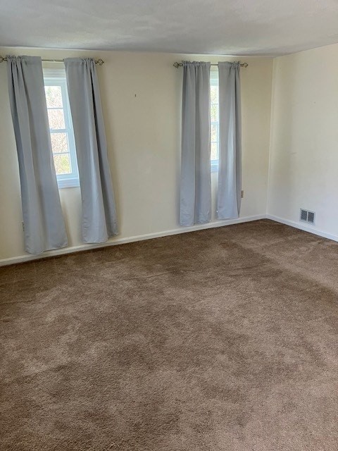 34 Lowell Road, Unit 36 Pepperell, MA 01463 - Photo 4 of 12 an empty room with windows