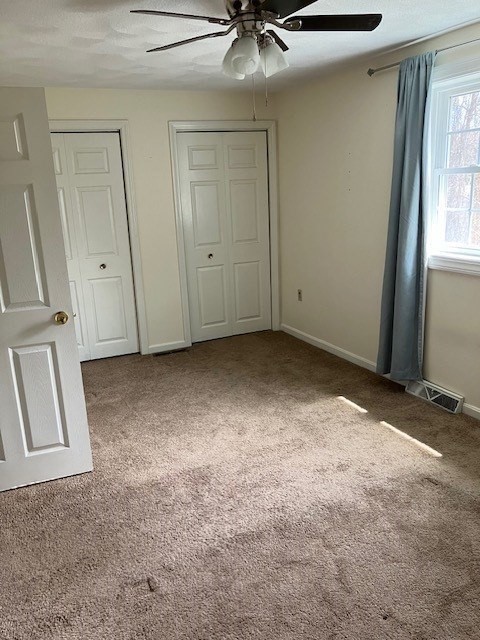 34 Lowell Road, Unit 36 Pepperell, MA 01463 - Photo 9 of 12 an empty room with a mirror
