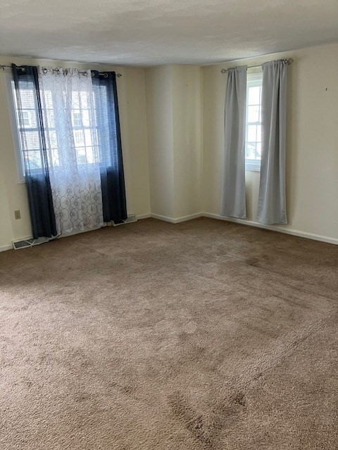 34 Lowell Road, Unit 36 Pepperell, MA 01463 - Photo 10 of 12 an empty room with windows