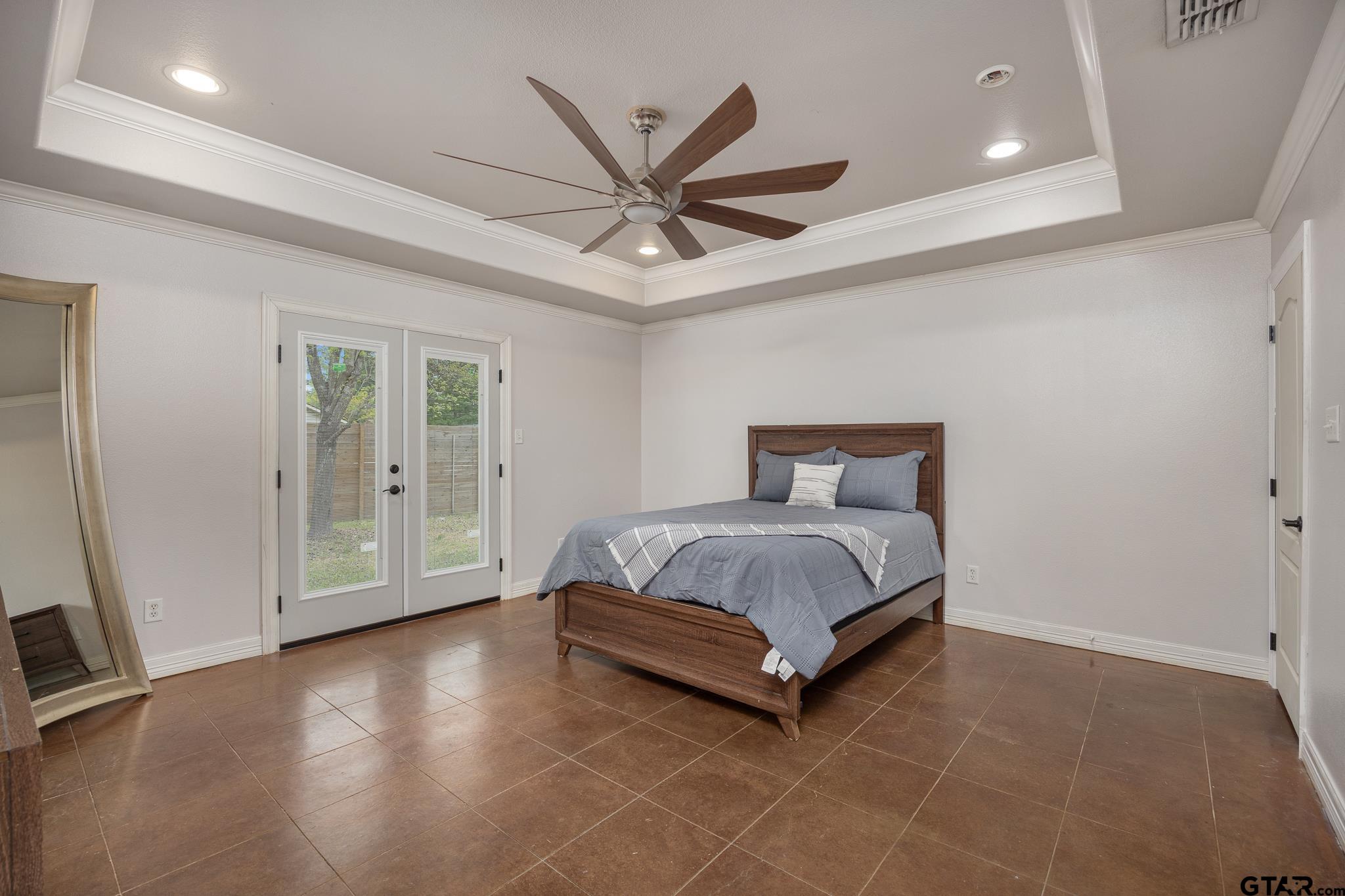710 Willowood Street Longview, TX 75604 - Photo 16 of 33 Primary bedroom with French doors to back yard.