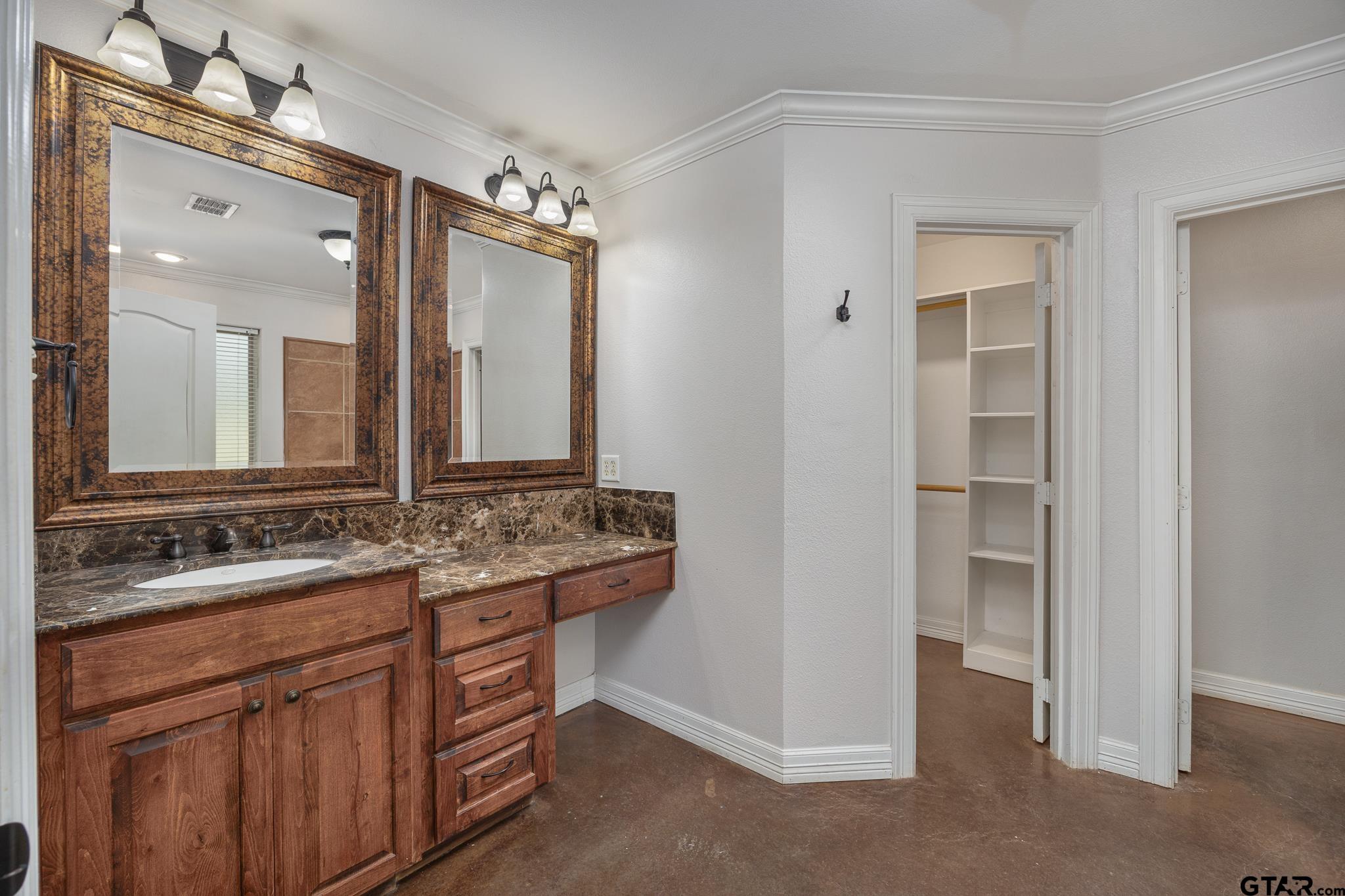 710 Willowood Street Longview, TX 75604 - Photo 17 of 33 Primary bathroom with WIC, garden tub, shower.