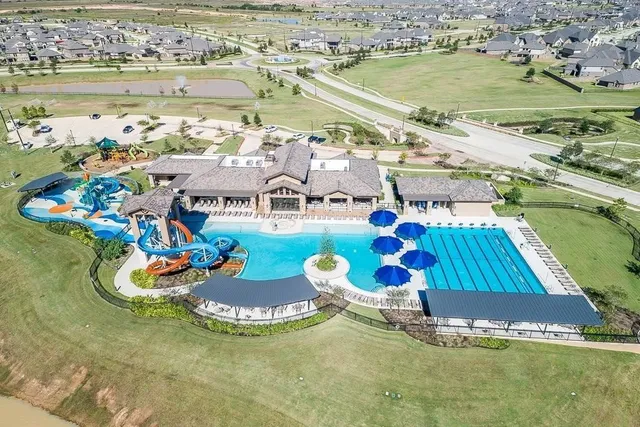 an aerial view of a house with a ocean view