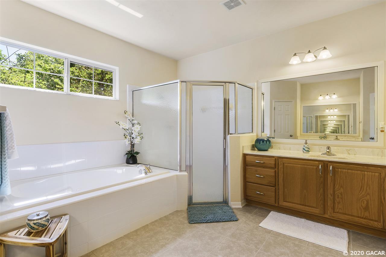 8321 Southwest 75th Road Gainesville, FL 32608 - Photo 19 of 29 Master Bathroom with his/hers sink and jacuzzi