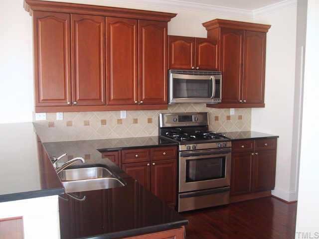 1131 Harp Street Raleigh, NC 27604 - Photo 3 of 10 Kitchen w/Granite Cntrtops,Gas Range,&Upgraded Cabinets