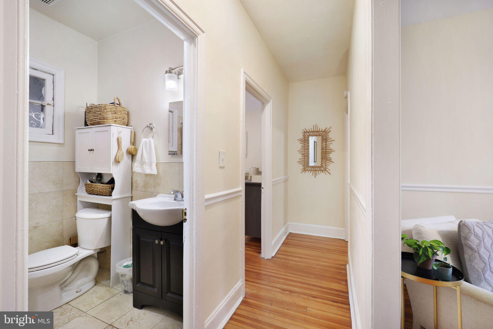 1426 12th Street Northwest, Unit 5 Washington, DC 20005 - Photo 11 of 21 a bathroom with a sink toilet and shower
