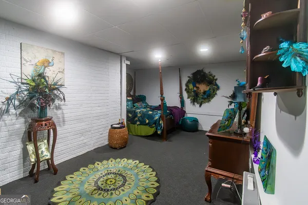 a room with furniture and a potted plant