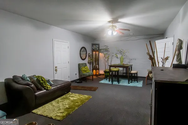 a living room with furniture and a table