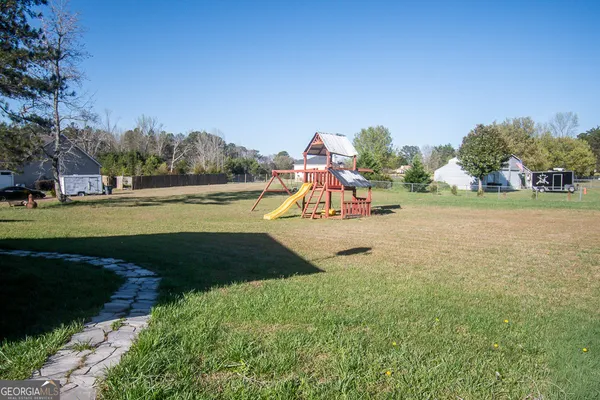 a view of a lake with a yard