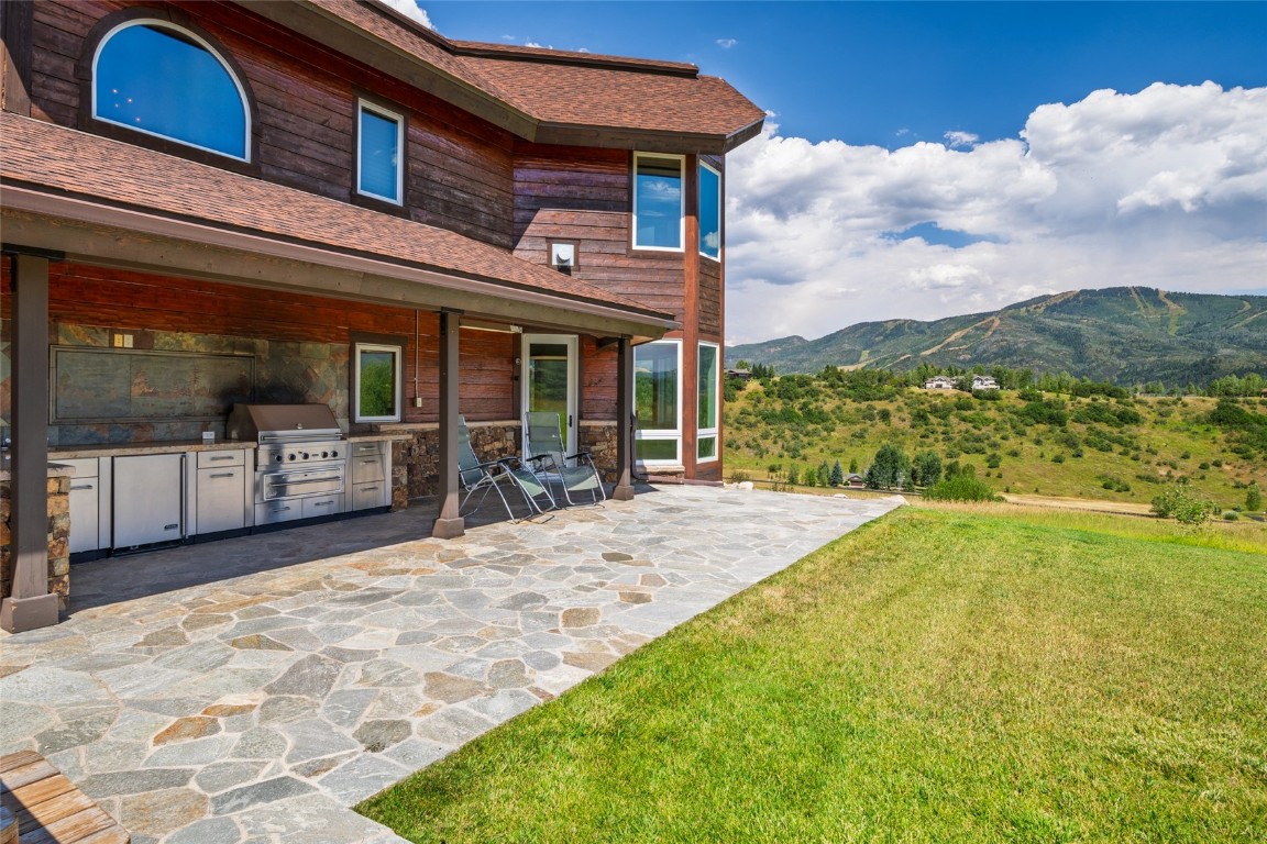 31105 Country Side Road Steamboat Springs, CO 80487 - Photo 16 of 50 a view of a house with swimming pool and porch