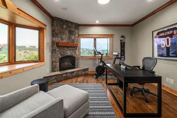 a living room with furniture fireplace and window
