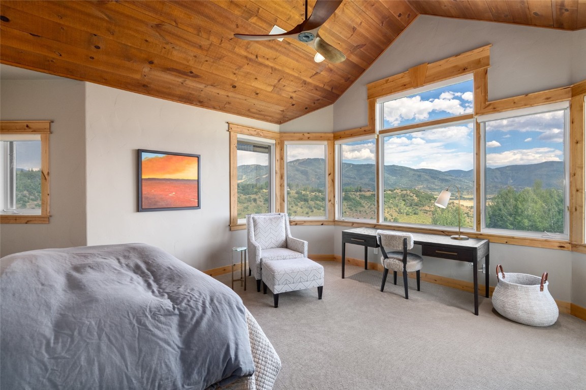 31105 Country Side Road Steamboat Springs, CO 80487 - Photo 28 of 50 a bedroom with furniture and a large window