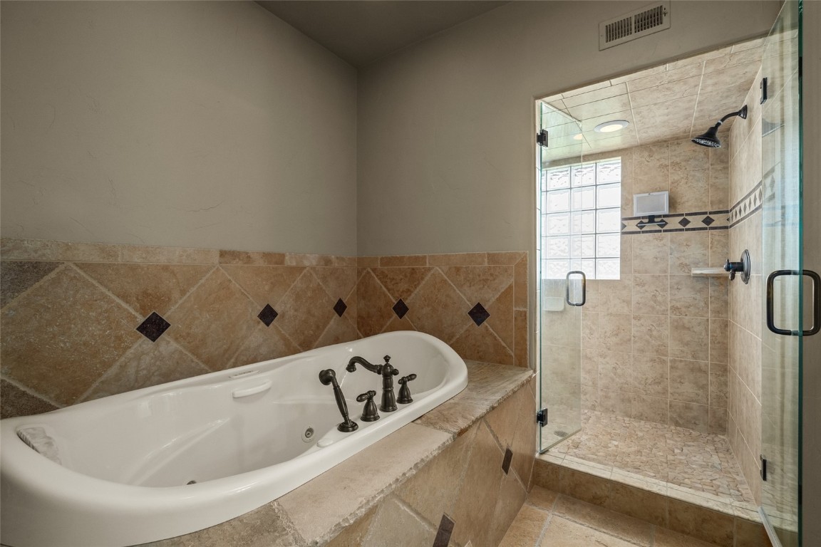 31105 Country Side Road Steamboat Springs, CO 80487 - Photo 33 of 50 a bathroom with a tub and shower