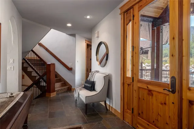 a view of an entryway with wooden floor and windows