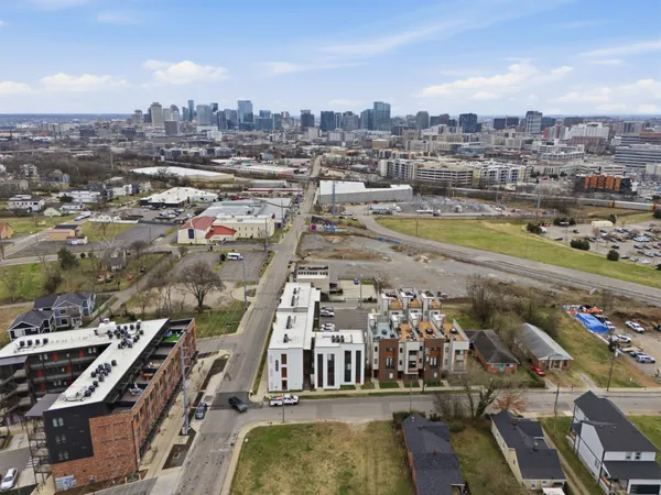 an aerial view of a house with a yard