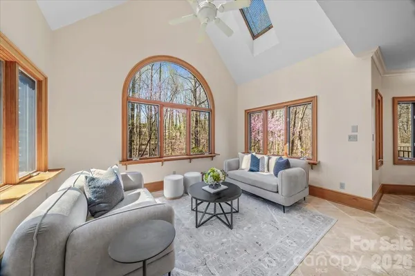 a spacious bedroom with a large bed and a couch