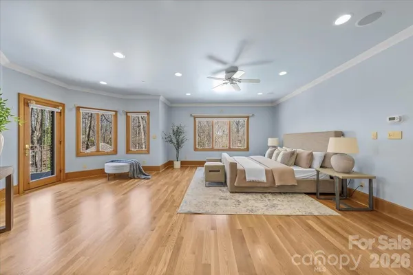 a spacious bedroom with a large bed and a window