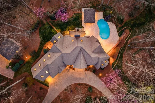 an aerial view of house with yard