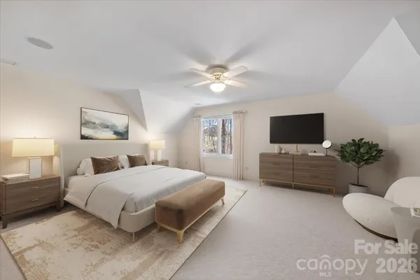 a living room with furniture and a ceiling fan