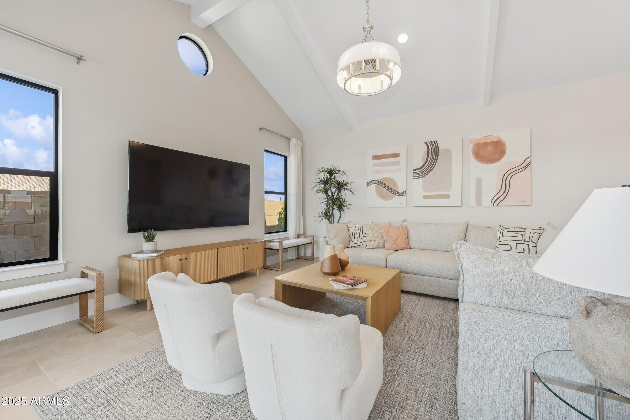 621 East Grayling Road San Tan Valley, AZ 85140 - Photo 10 of 33 a living room with furniture and a flat screen tv
